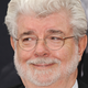 Image for article titled Fine, have a picture of George Lucas gently cradling Baby Yoda in his arms